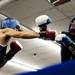 Northend boxer Casanovis Williams hits A-Square fighter LaSean Holmes in the seventh bout on Friday, July 19. Daniel Brenner I AnnArbor.com